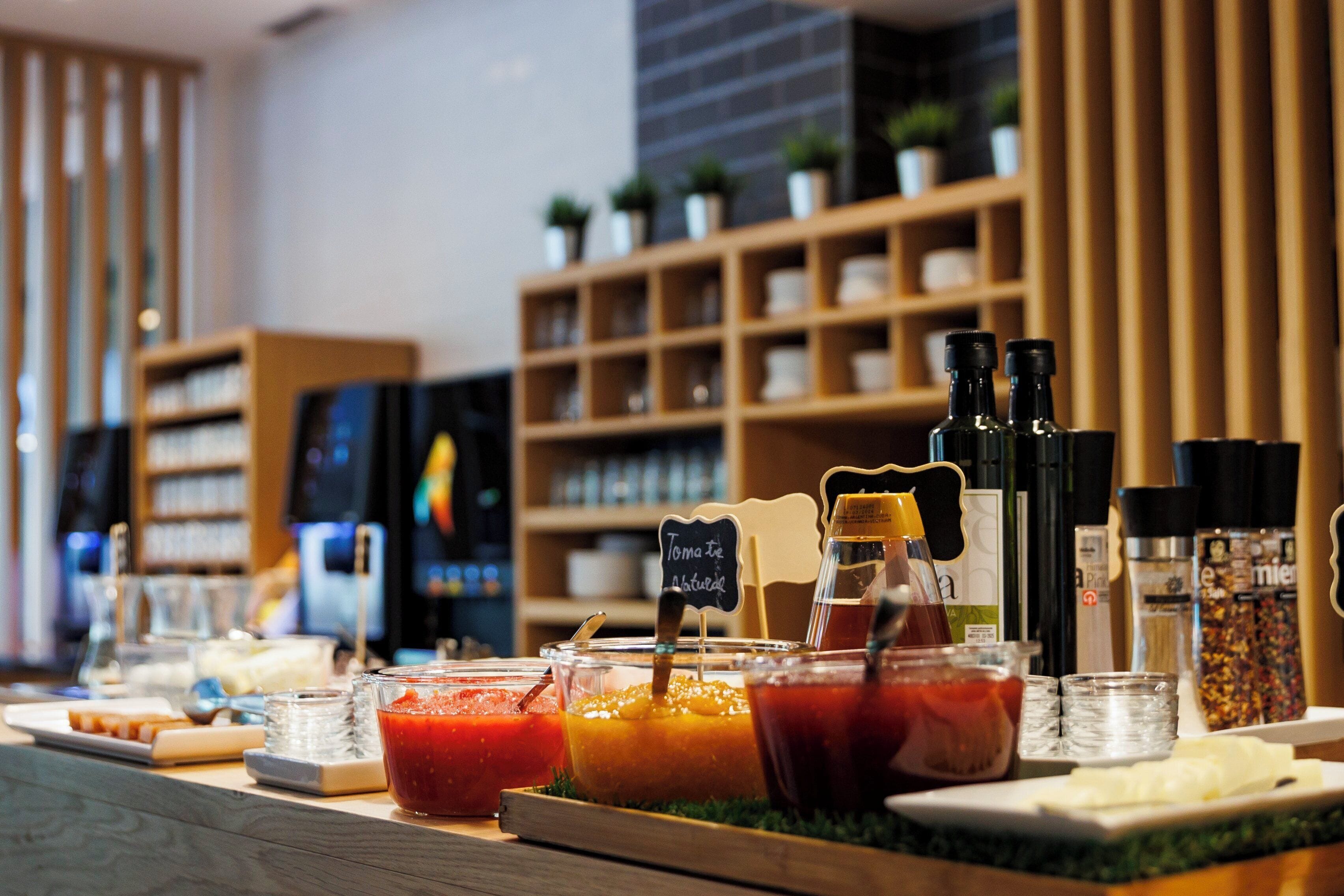 A buffet spread with various food items and condiments.