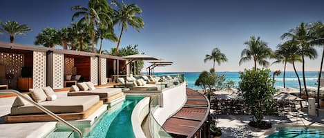 Outdoor pool, open 7:00 AM to 7:00 PM, pool cabanas (surcharge)