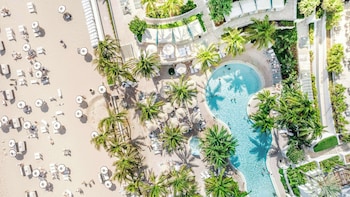 On the beach, beach cabanas, sun loungers, beach umbrellas at Diplomat Beach Resort Hollywood, Curio Collection by Hilton