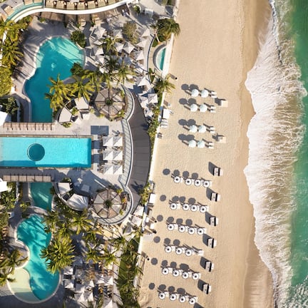 On the beach, beach cabanas, sun loungers, beach umbrellas