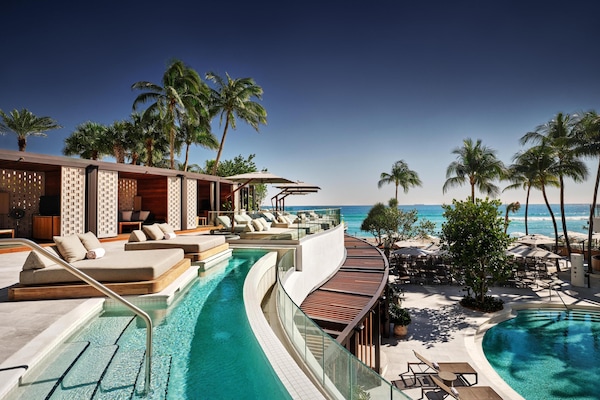 Outdoor pool, open 7:00 AM to 7:00 PM, pool cabanas (surcharge)