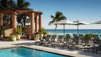 Outdoor pool, open 7:00 AM to 7:00 PM, pool cabanas (surcharge)