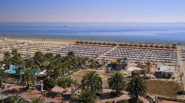 Private beach, white sand, beach umbrellas, beach volleyball