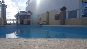 Seasonal outdoor pool, pool umbrellas, sun loungers