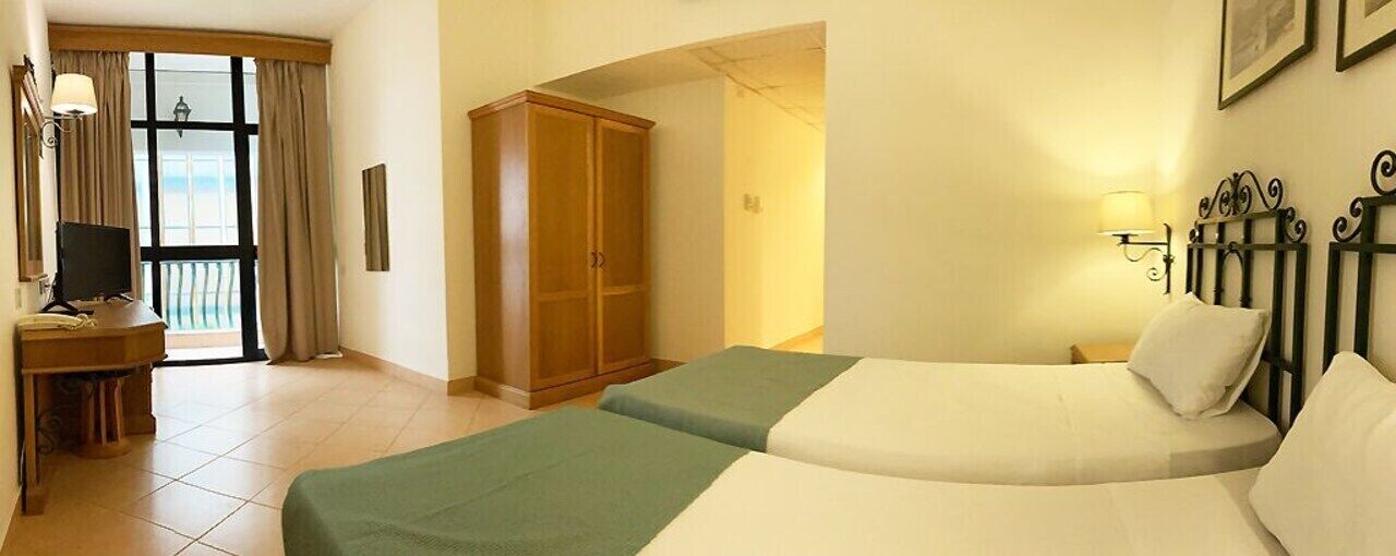 Minibar, desk, laptop workspace, blackout curtains