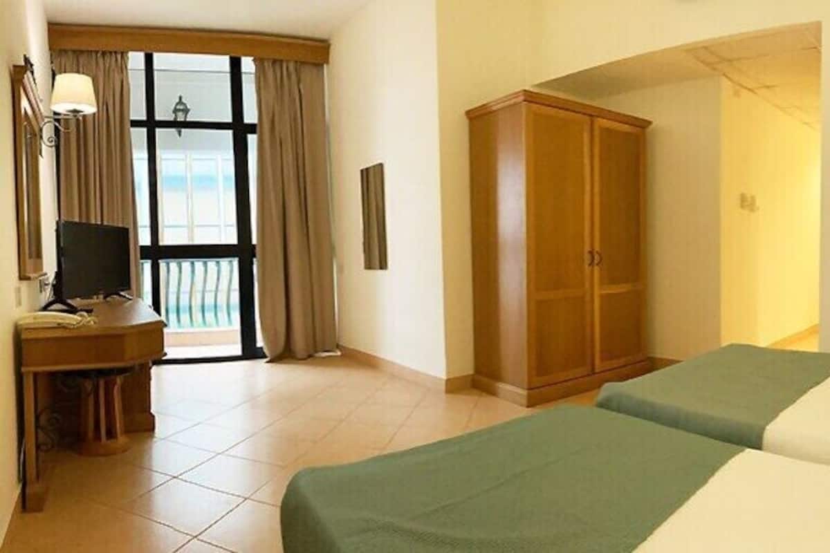 Minibar, desk, laptop workspace, blackout curtains