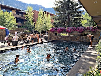 Outdoor pool, open 9:00 AM to 9:00 PM, pool umbrellas, sun loungers at Aspen Square Condominium Hotel