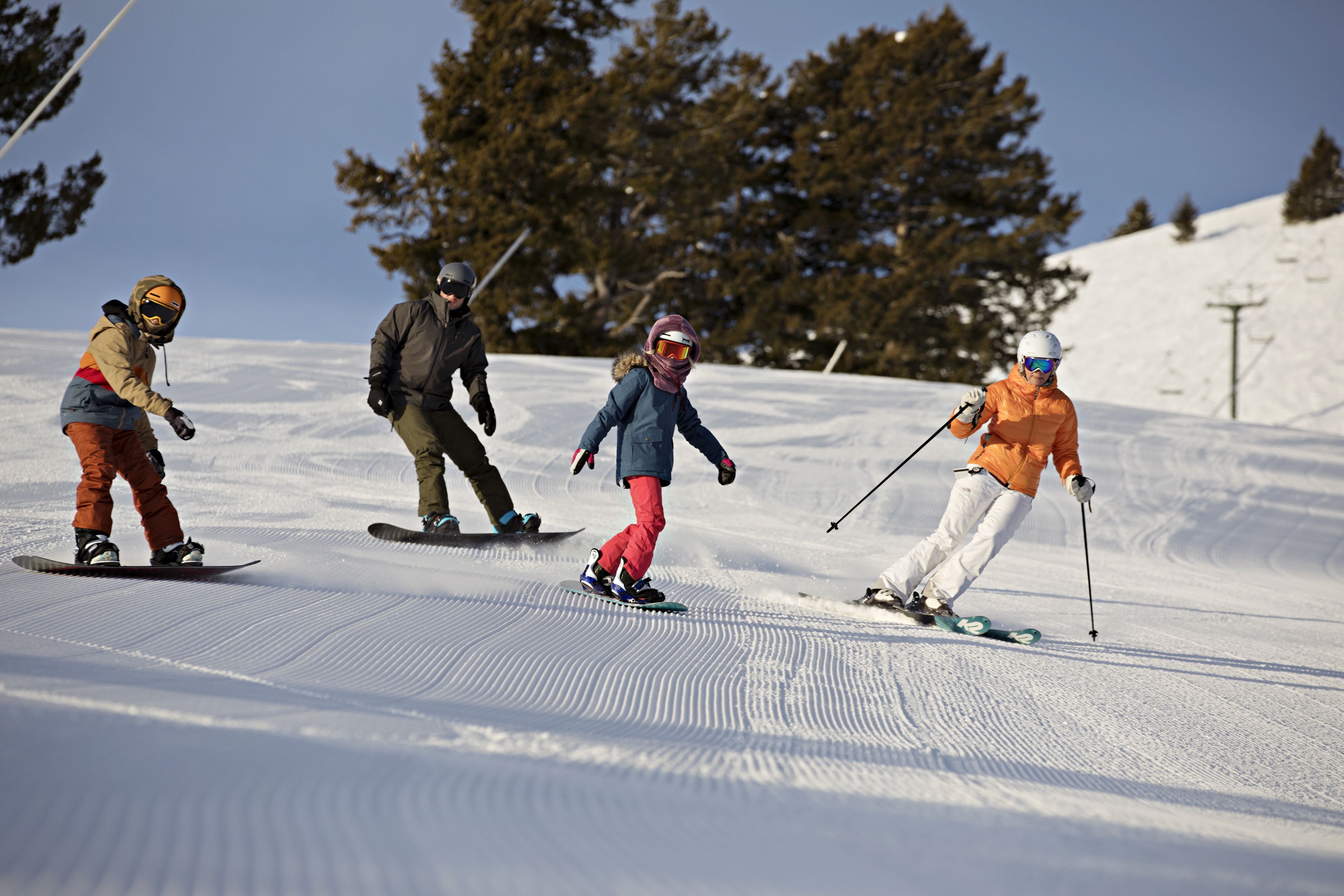 A group of people skiing on a snowy slope.