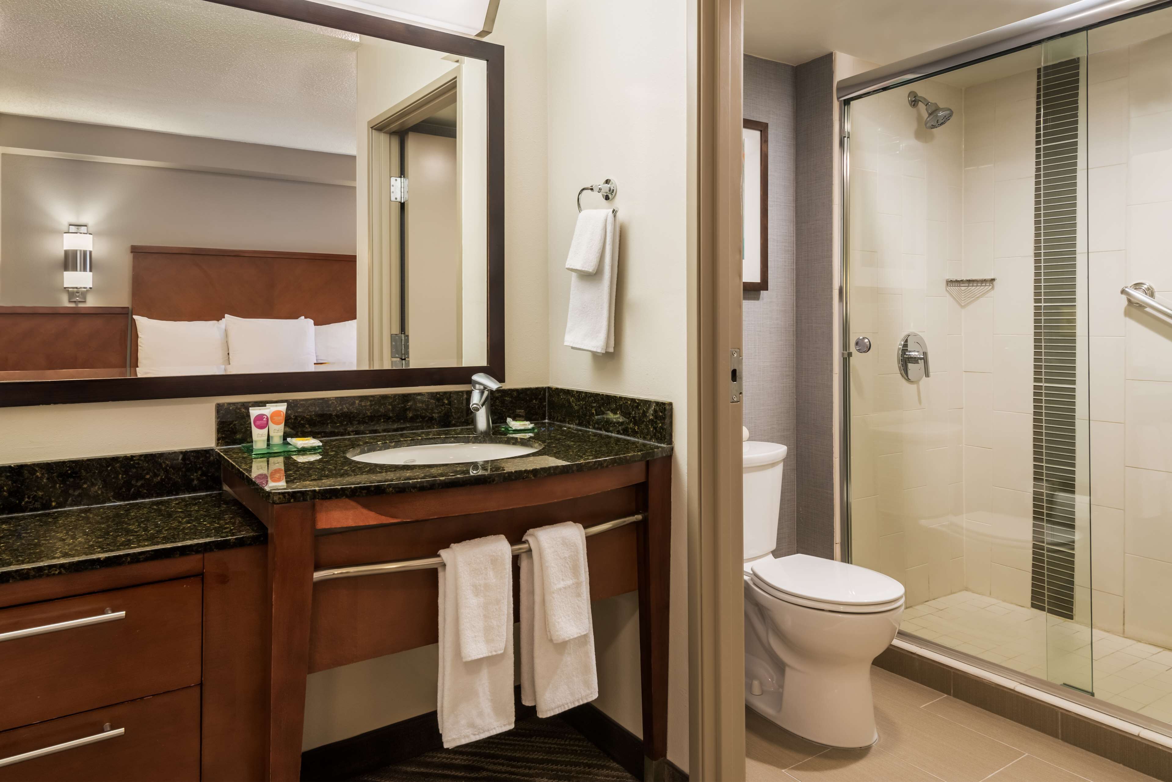 designer toiletries, hair dryer, towels