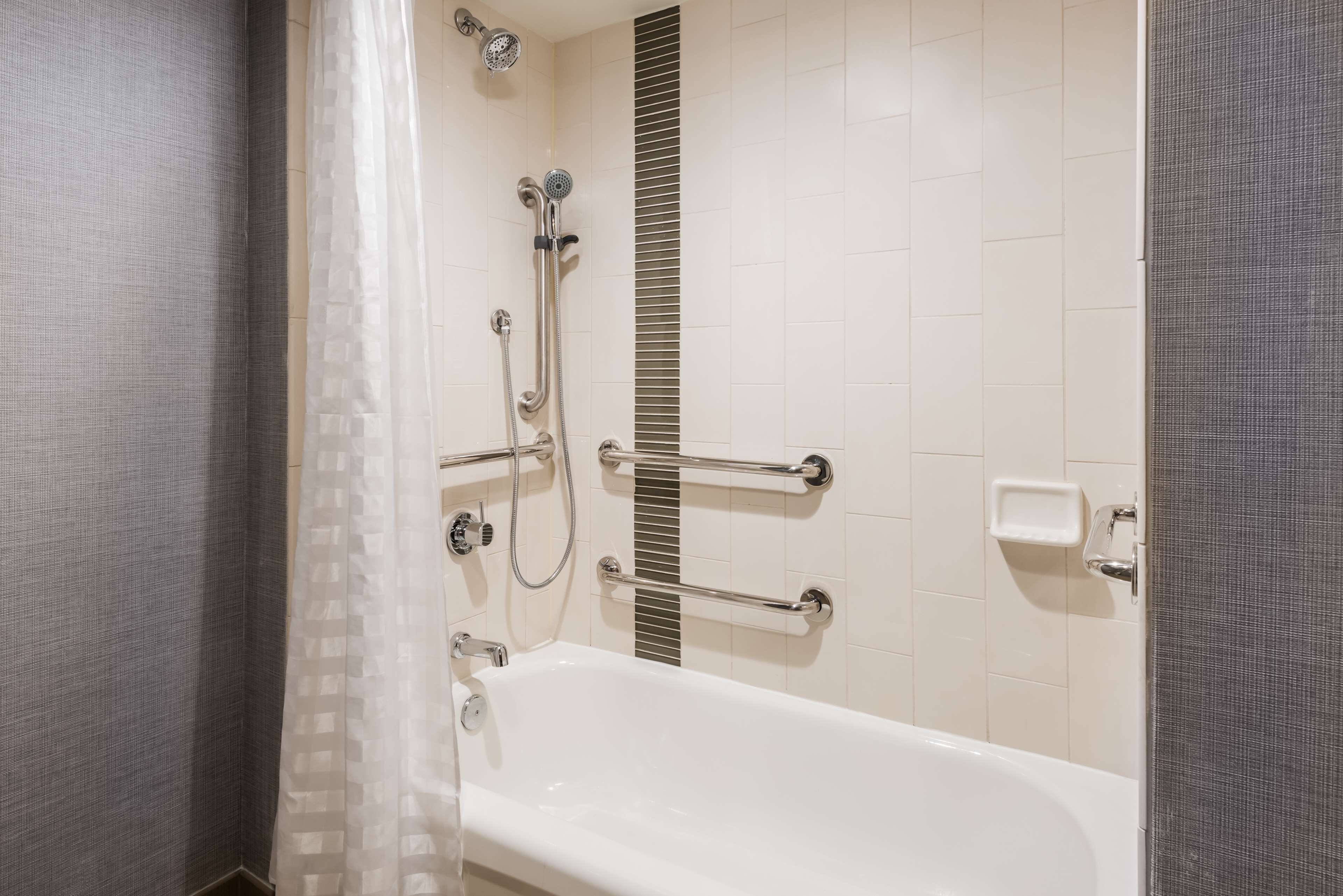 designer toiletries, hair dryer, towels