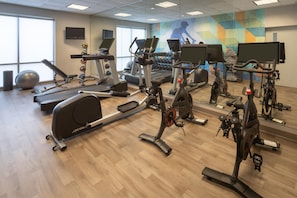 A gym with various cardio machines, free weights, and exercise balls. - Hyatt Place Bentonville/Rogers (Rogers)
