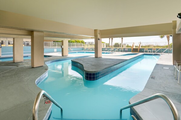 3 outdoor pools, a heated pool, open 9:00 AM to 11:00 PM, pool umbrellas