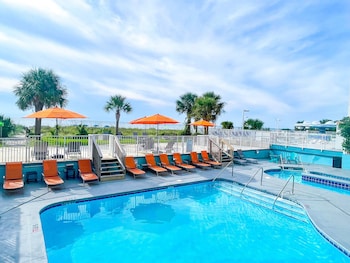 3 outdoor pools, a heated pool, open 9:00 AM to 11:00 PM, pool umbrellas at Palette Resort Myrtle Beach