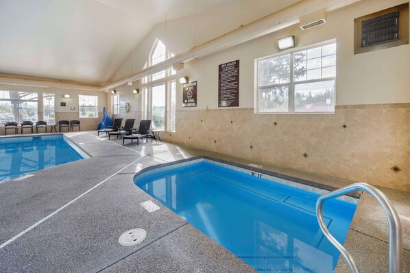 Indoor pool, open 8:00 AM to 10:00 PM, pool loungers