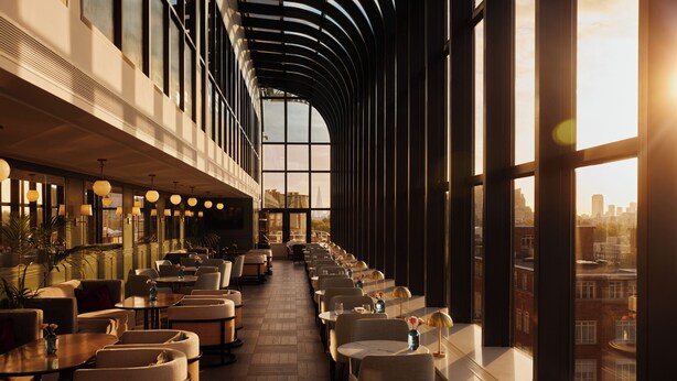 A modern hotel interior with a long corridor of seating, large windows, and a city view. - Jumeirah Carlton Tower London (London)