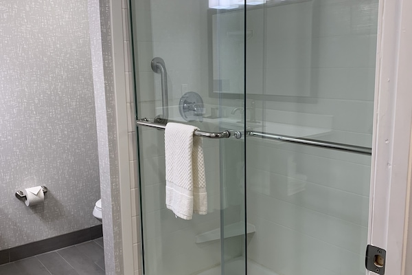 Designer toiletries, hair dryer, towels