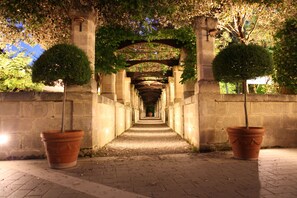 Stroll through the tranquil gardens, surrounded by lush greenery and historic charm.