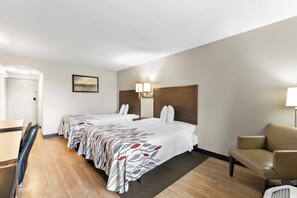 A hotel room with two beds, a desk, a chair, and a lamp. - Red Roof Inn Lancaster (Lancaster)