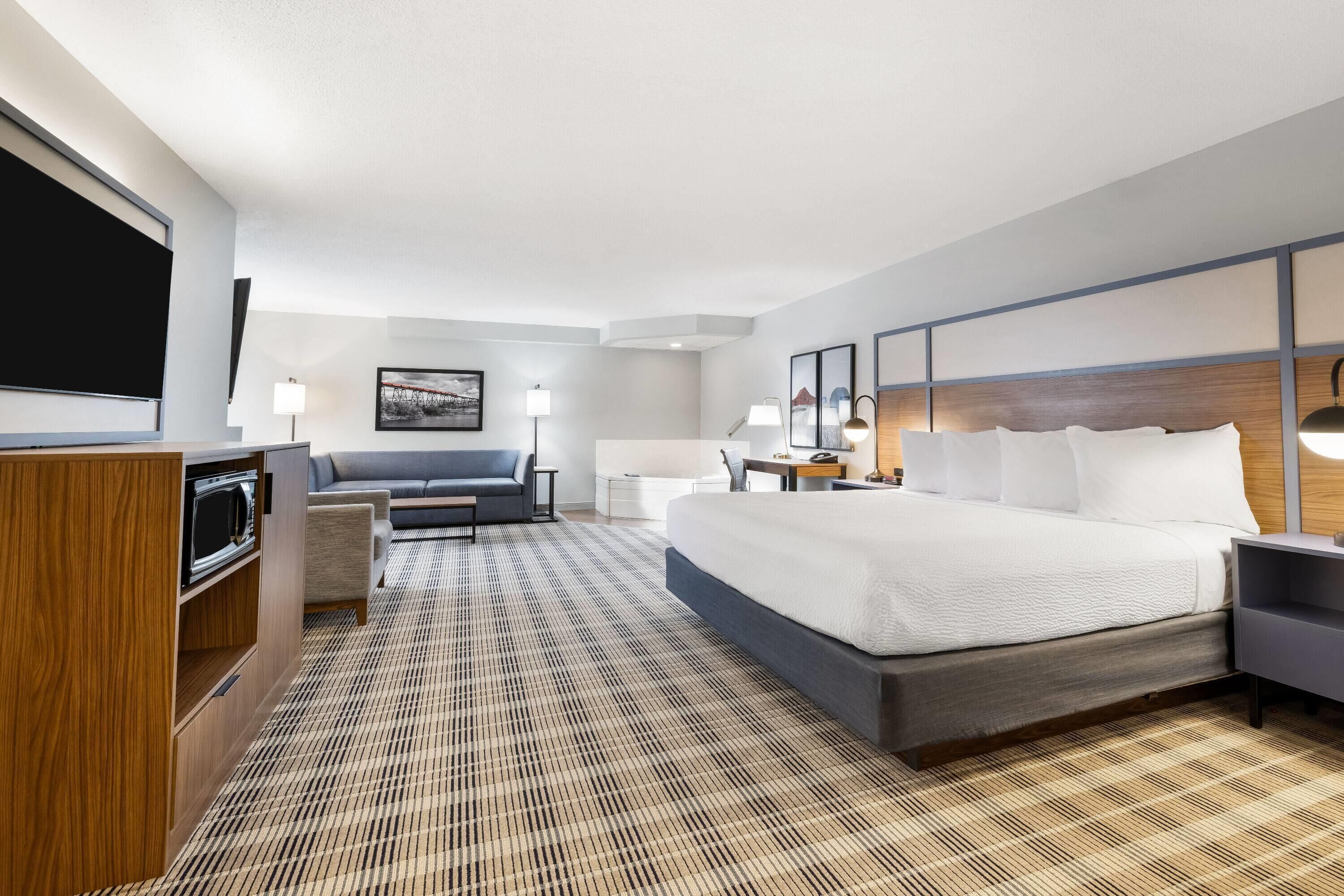 Suíte premier, 1 cama King, para não fumantes | Edredons de pluma, cofres nos quartos, escrivaninha