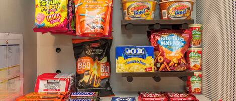 A snack display with various brands and types of snacks.