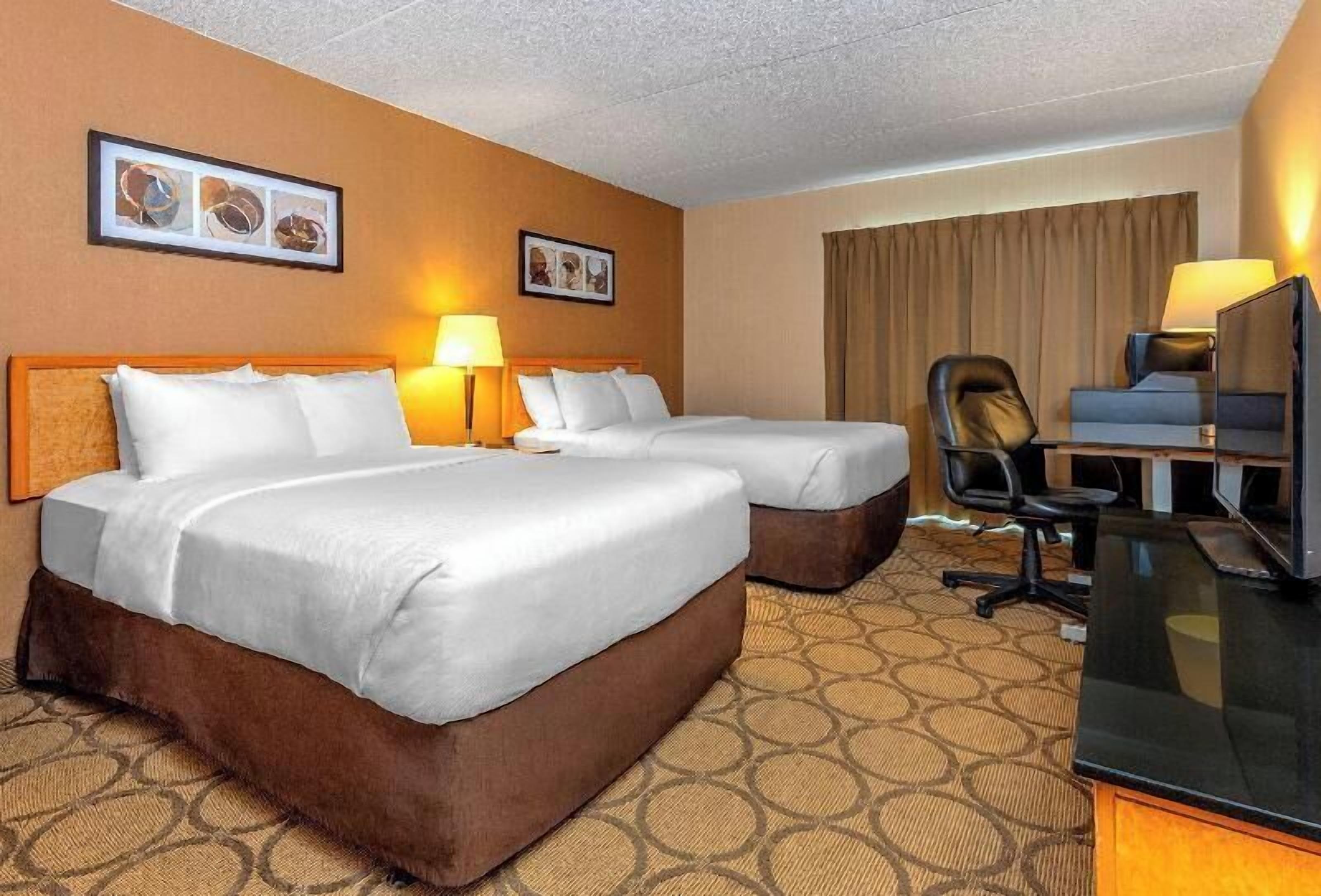 Premium bedding, pillow-top beds, desk, blackout curtains