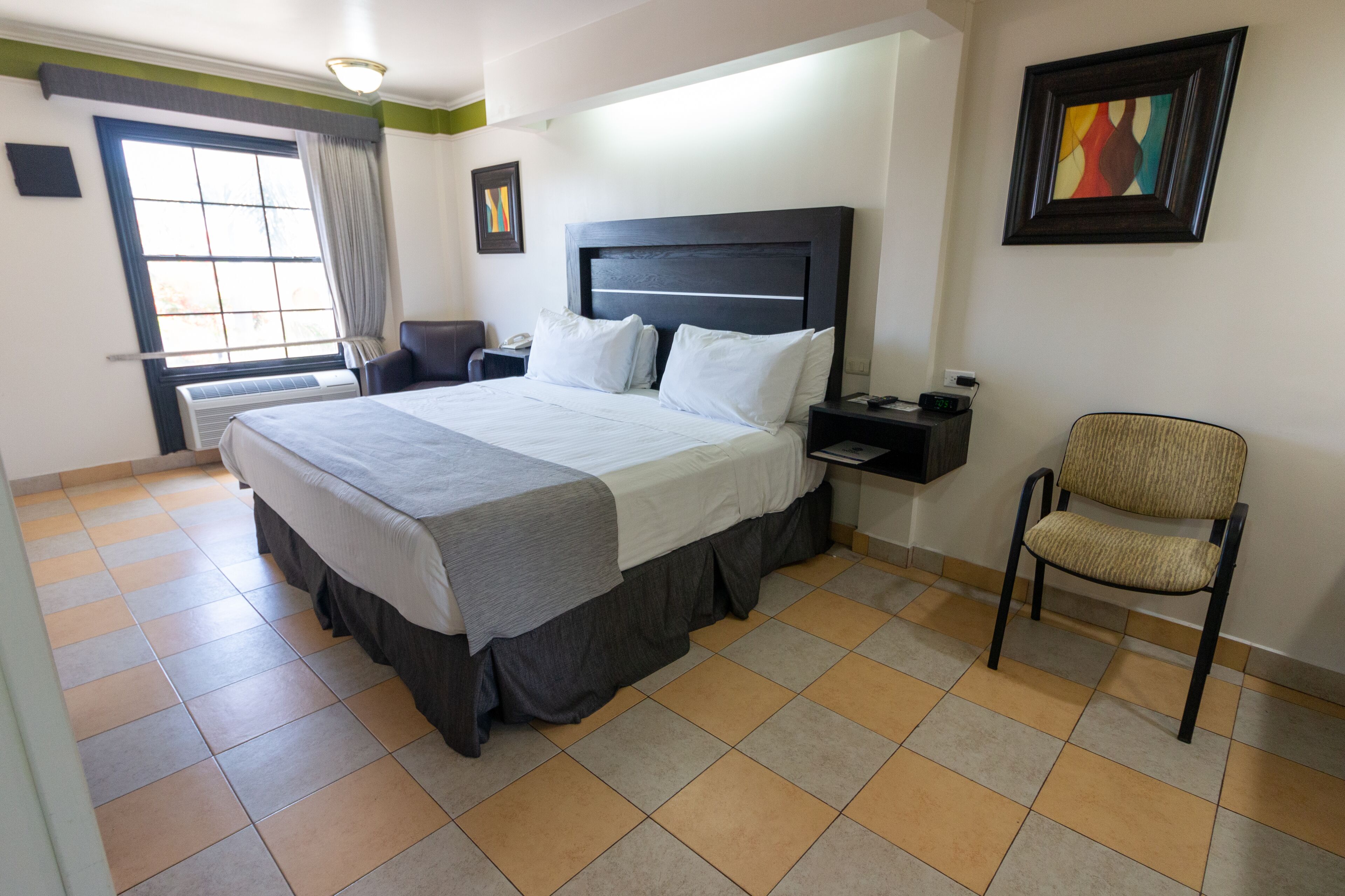 standard room, 1 king bed, non smoking | in-room safe, individually decorated, individually furnished, desk