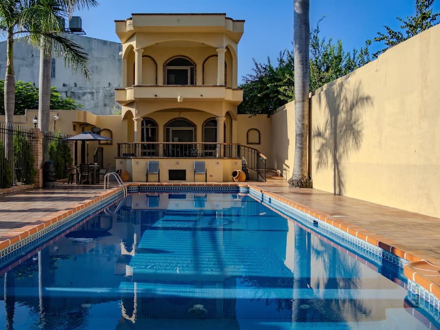 Seasonal outdoor pool, open 9:00 AM to 9:00 PM, pool loungers