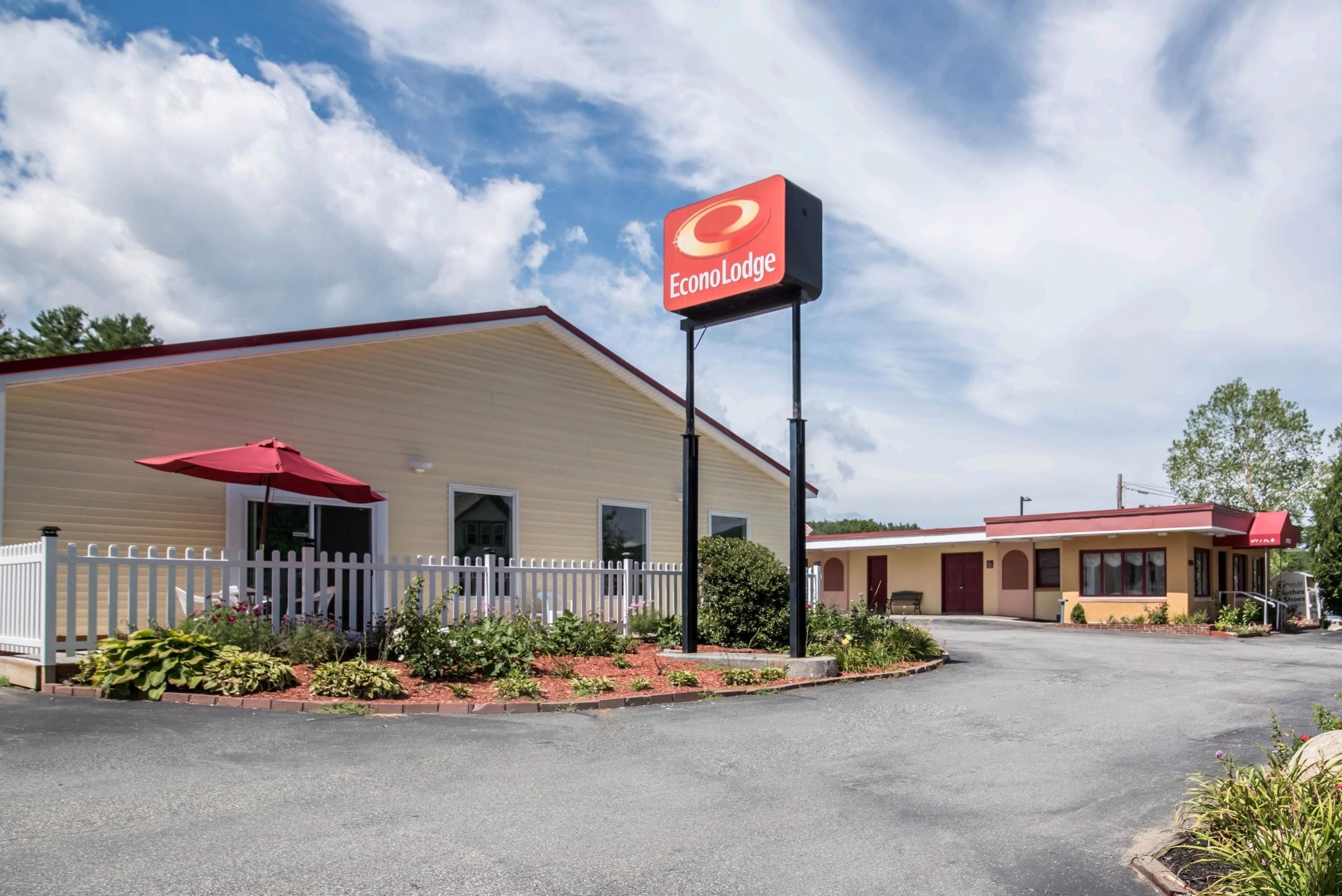 A two-story motel with a red awning and a sign that reads "EconoLodge."