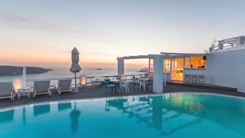 Outdoor pool, open 11:00 AM to 8:00 PM, pool umbrellas, pool loungers