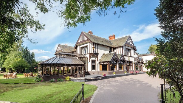 A large, traditional building with a symmetrical facade, a covered patio area, and a well-maintained lawn. - Leonardo Boutique Huntingtower Perth (Perth)