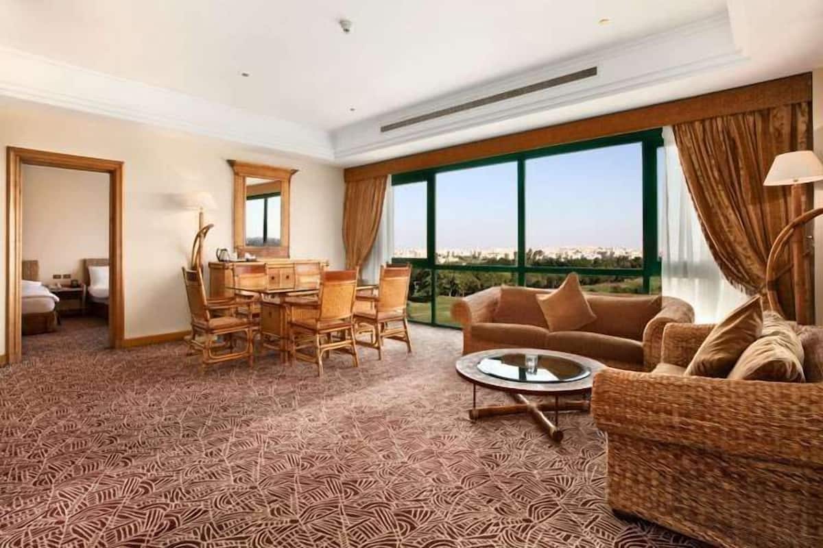 Executive Suite, 1 King Bed (Duplex) | Living area | 32-inch LCD TV with satellite channels, TV, fireplace