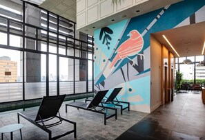 Outdoor pool, open 6:00 AM to 10:00 PM, pool loungers