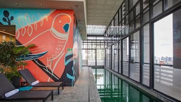 Outdoor pool, open 6:00 AM to 10:00 PM, pool loungers