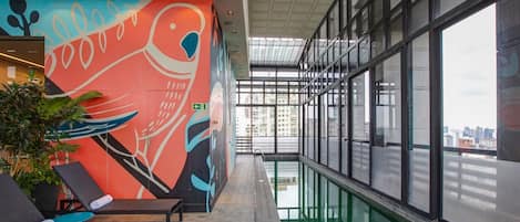 Outdoor pool, open 6:00 AM to 10:00 PM, pool loungers