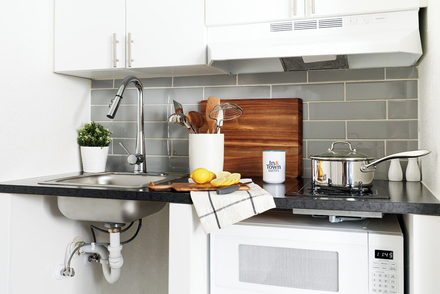 Fridge, microwave, stovetop, dining table