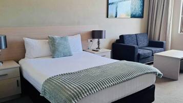 Desk, laptop workspace, blackout curtains, iron/ironing board