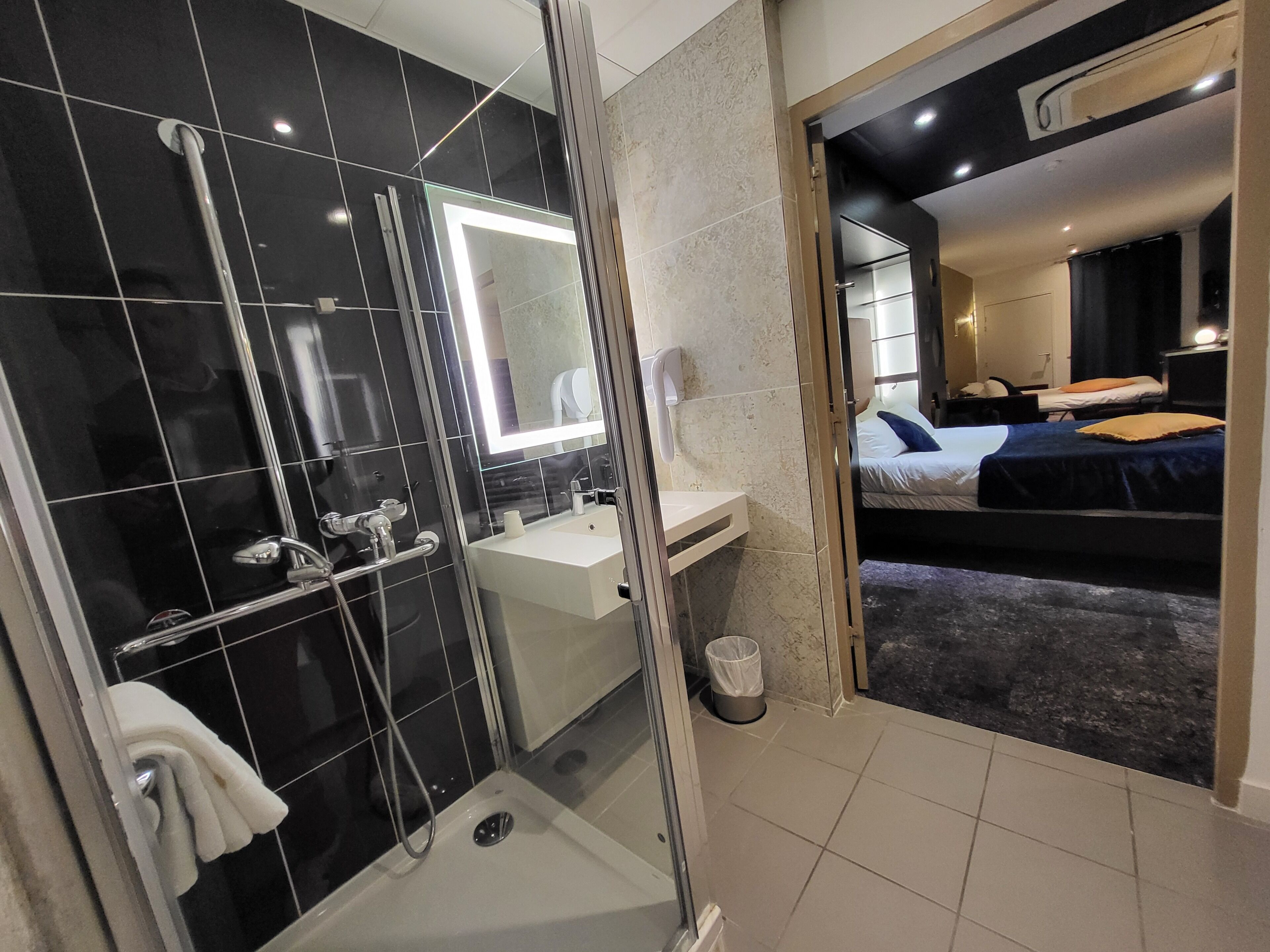 Deluxe Quadruple Room | Bathroom | Eco-friendly toiletries, hair dryer, towels