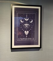 A framed artwork with celestial and eye motifs, titled "L'IMPERATRICE".