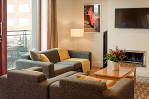 Two Bedroom Penthouse Apartment | Living area | 40-inch flat-screen TV with satellite channels, plasma TV