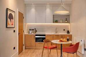 Signature One Bedroom Apartment | Living area | 40-inch flat-screen TV with satellite channels, plasma TV - Premier Suites Dublin Leeson Street (Dublin)