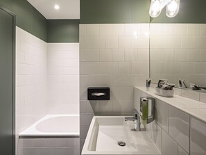 Designer toiletries, hair dryer, towels