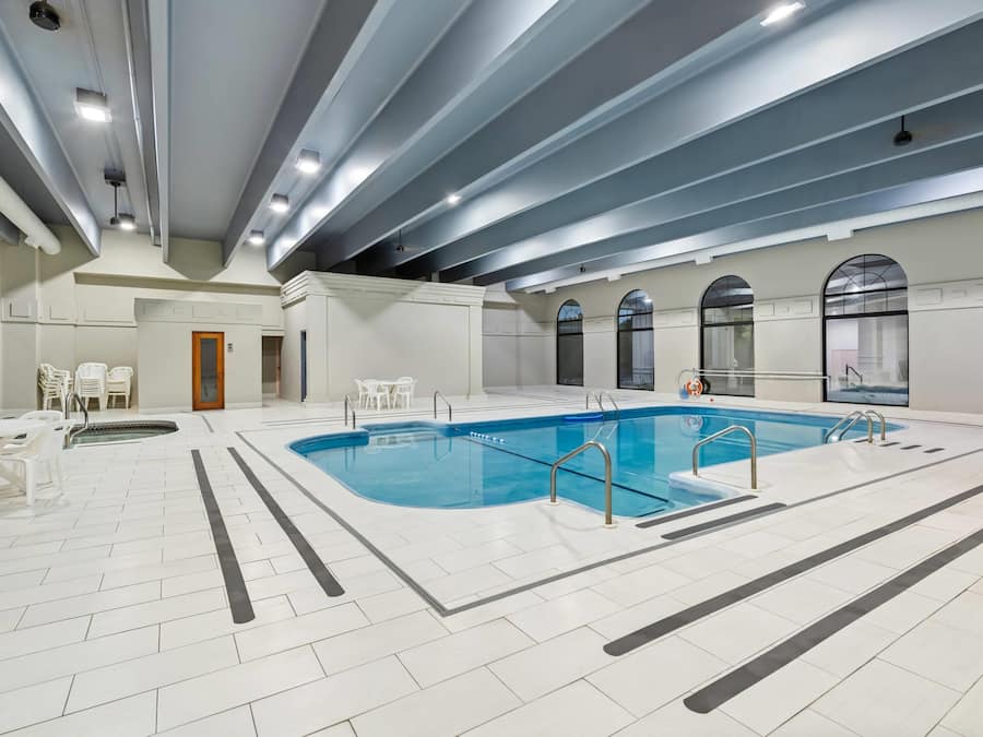 Indoor pool, seasonal outdoor pool, pool umbrellas, pool loungers