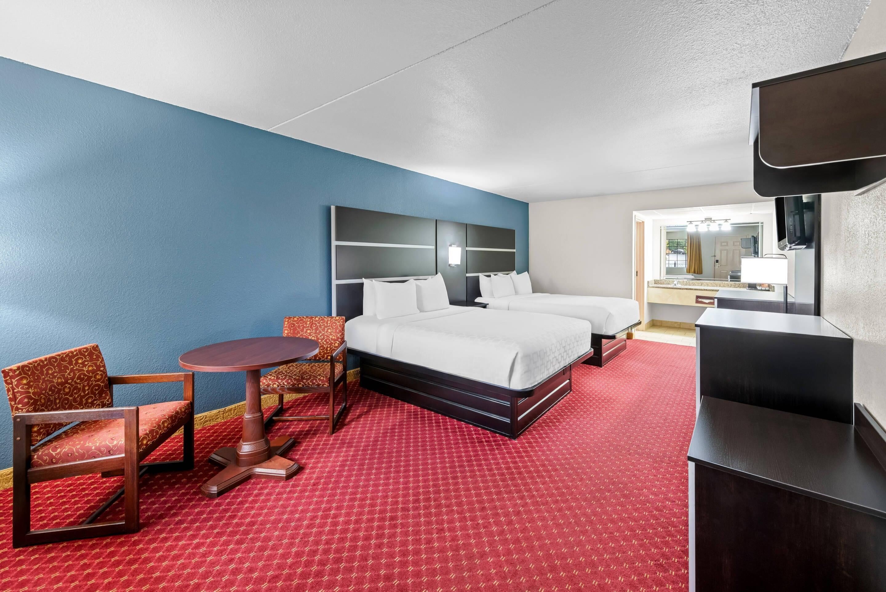 Standard Room, 2 Queen Beds, Non Smoking | Pillow-top beds, desk, laptop workspace, iron/ironing board