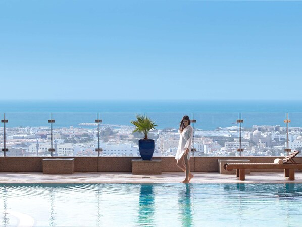 2 outdoor pools, pool umbrellas, pool loungers