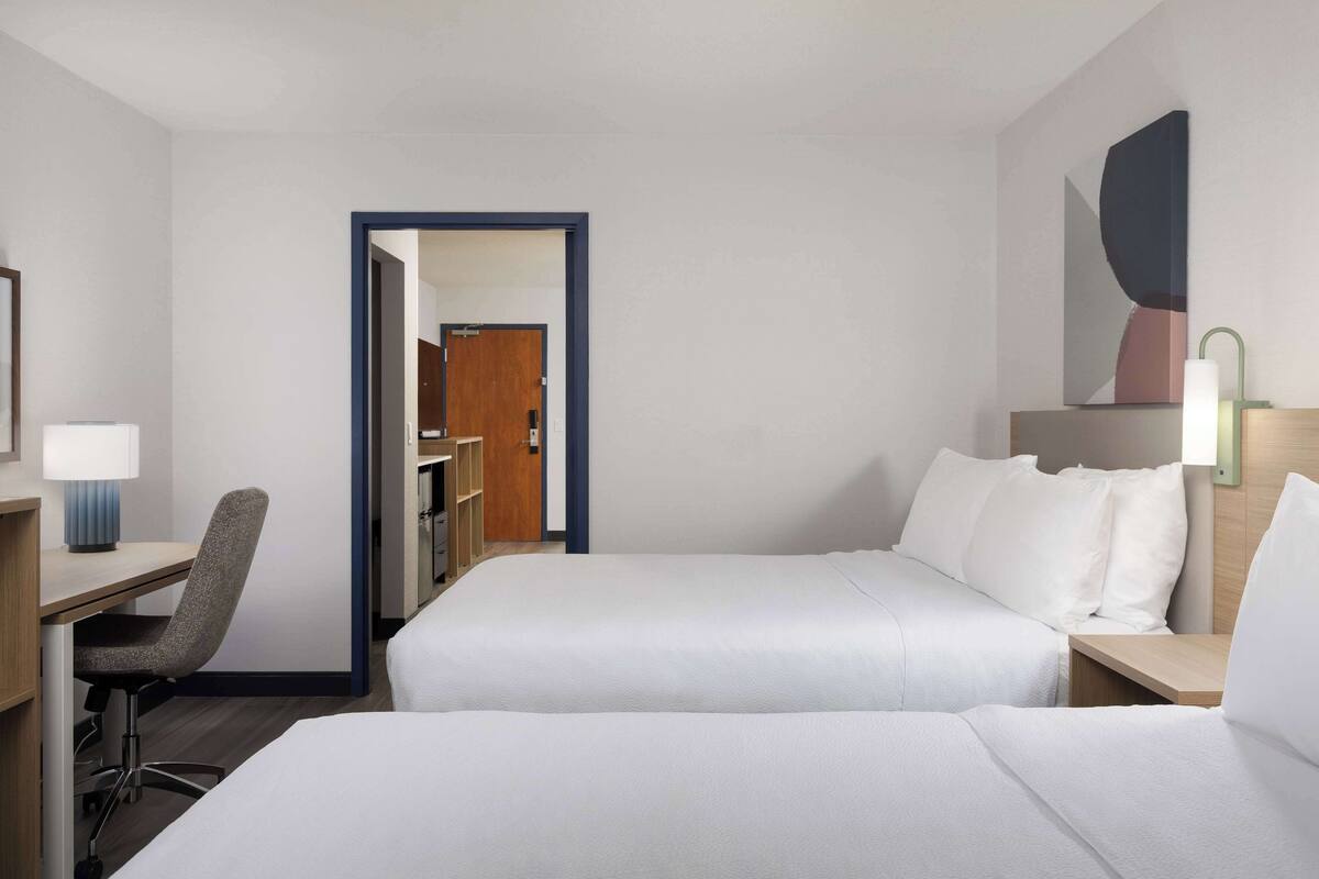 Suite, 2 Queen Beds | Desk, laptop workspace, iron/ironing board, cribs (free)