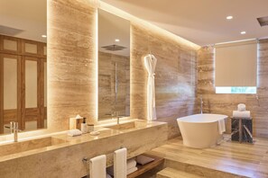 Separate bathtub and shower, designer toiletries, hair dryer, bathrobes