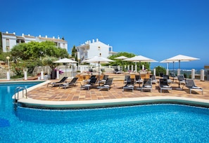 Seasonal outdoor pool, open 10:30 AM to 7:30 PM, pool umbrellas