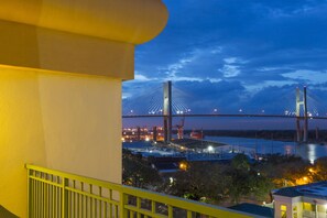 A view of a bridge at dusk with a building in the foreground. - DoubleTree by Hilton Hotel Savannah Historic District (Savannah)