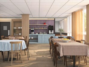 Un comedor moderno con manteles a cuadros, sillas de madera y una barra central con una máquina de café.