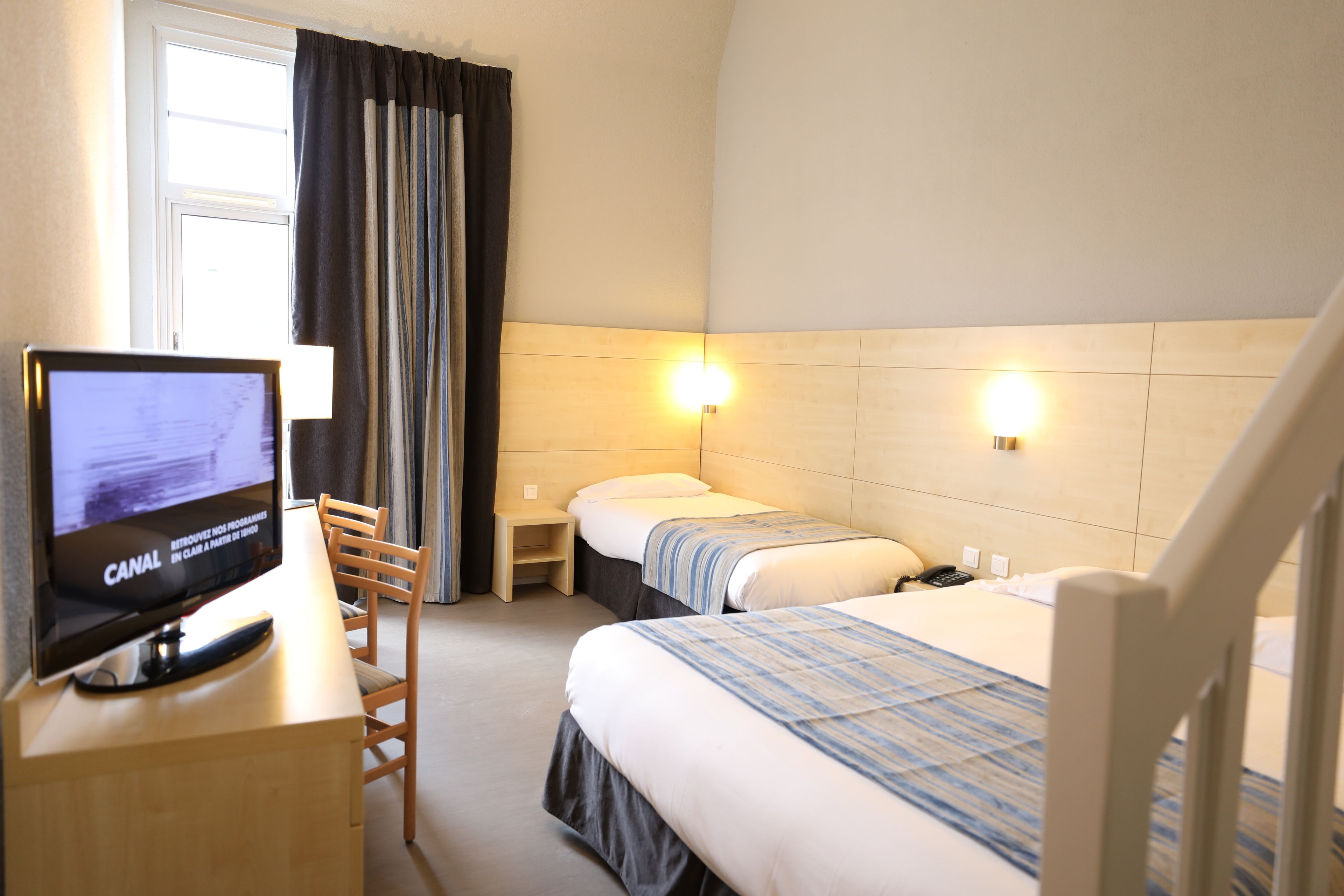 family quadruple room, multiple beds | in-room safe, desk, blackout curtains, soundproofing